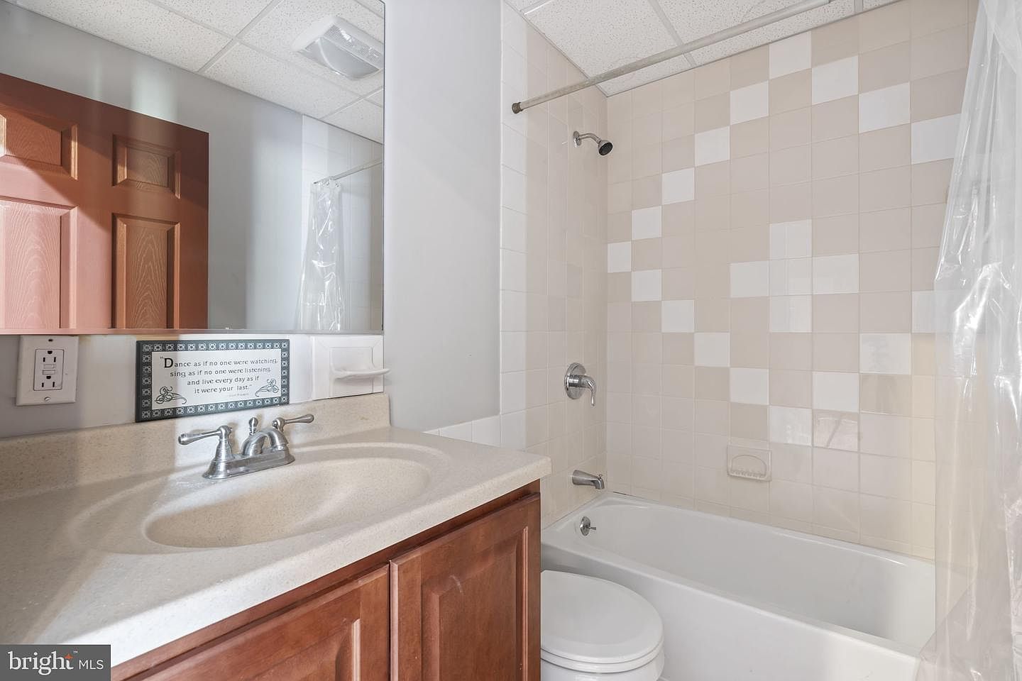 A secondary bath off the bedroom wing, with corner tub and tile shower surround